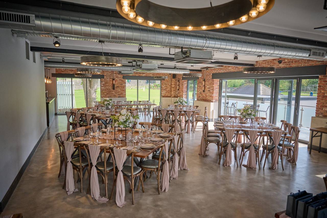 Tollgate Suite at The Hurt Arms: Industrial-chic wedding venue with elegant rustic decor. - Banner