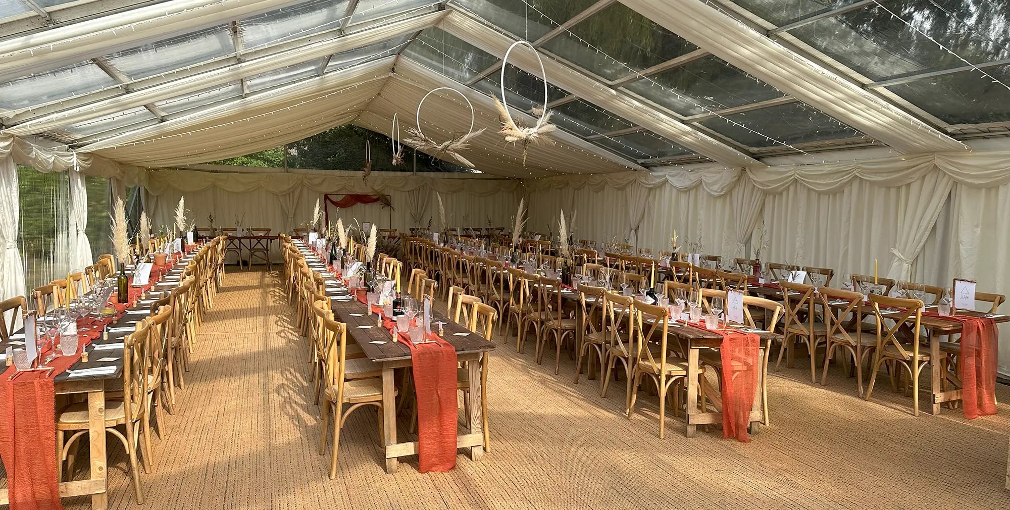Marquee event space at Nottingham Castle with banquet tables for weddings and corporate dinners.