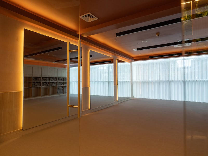 RE:TREAT Studio at The Lowry Hotel: mirrored wellness studio for luxury workshops and events.