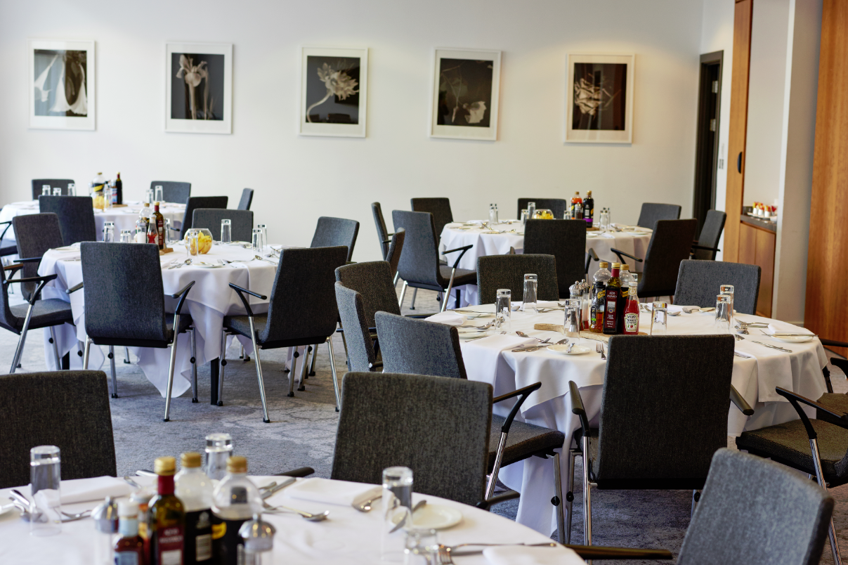 Corporate banquet setup in The Lowry Hotel Meeting Room 2 with professional round-table seating.