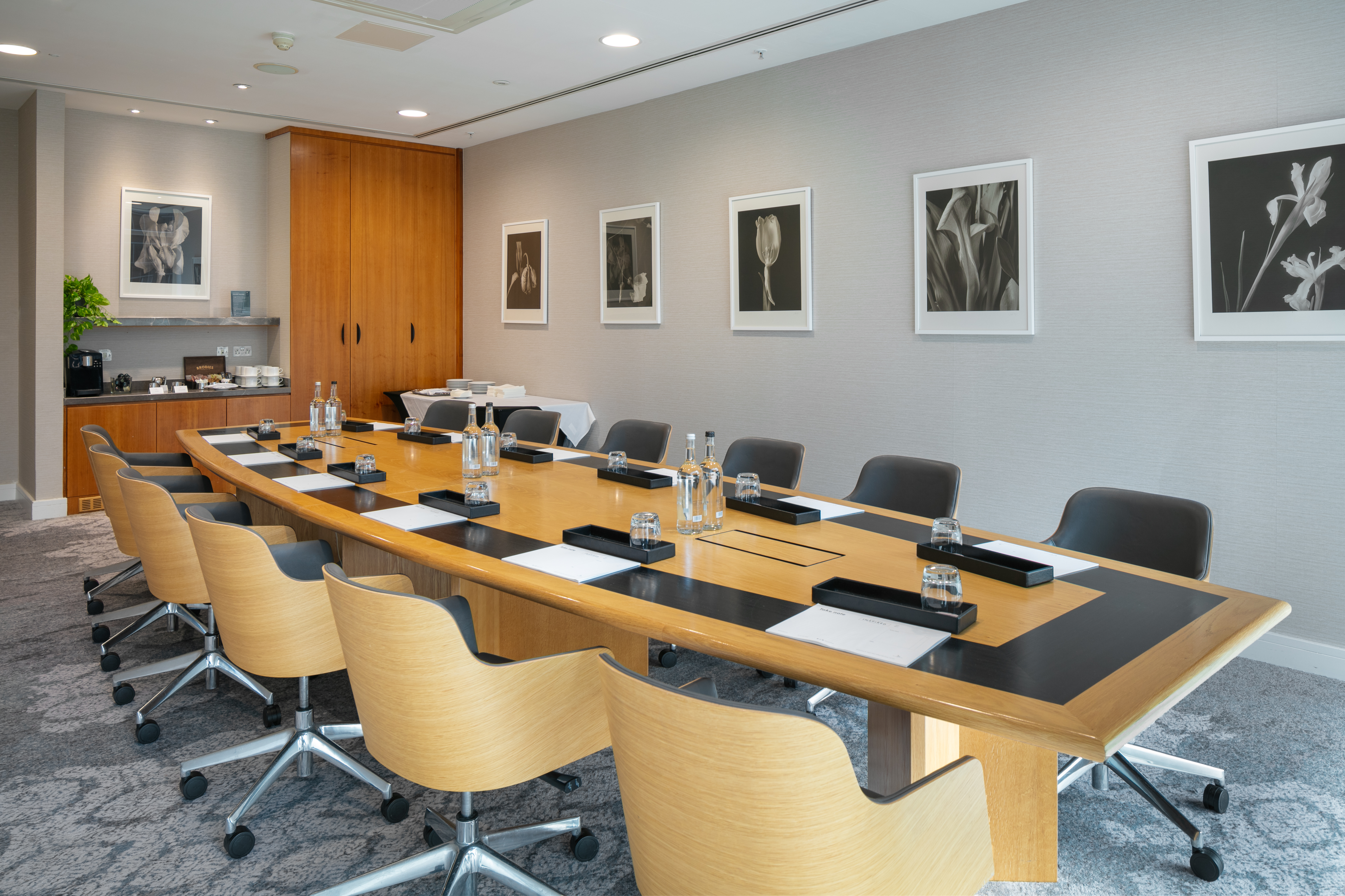 Boardroom at The Lowry Hotel with tech-ready setup for executive meetings and corporate events.