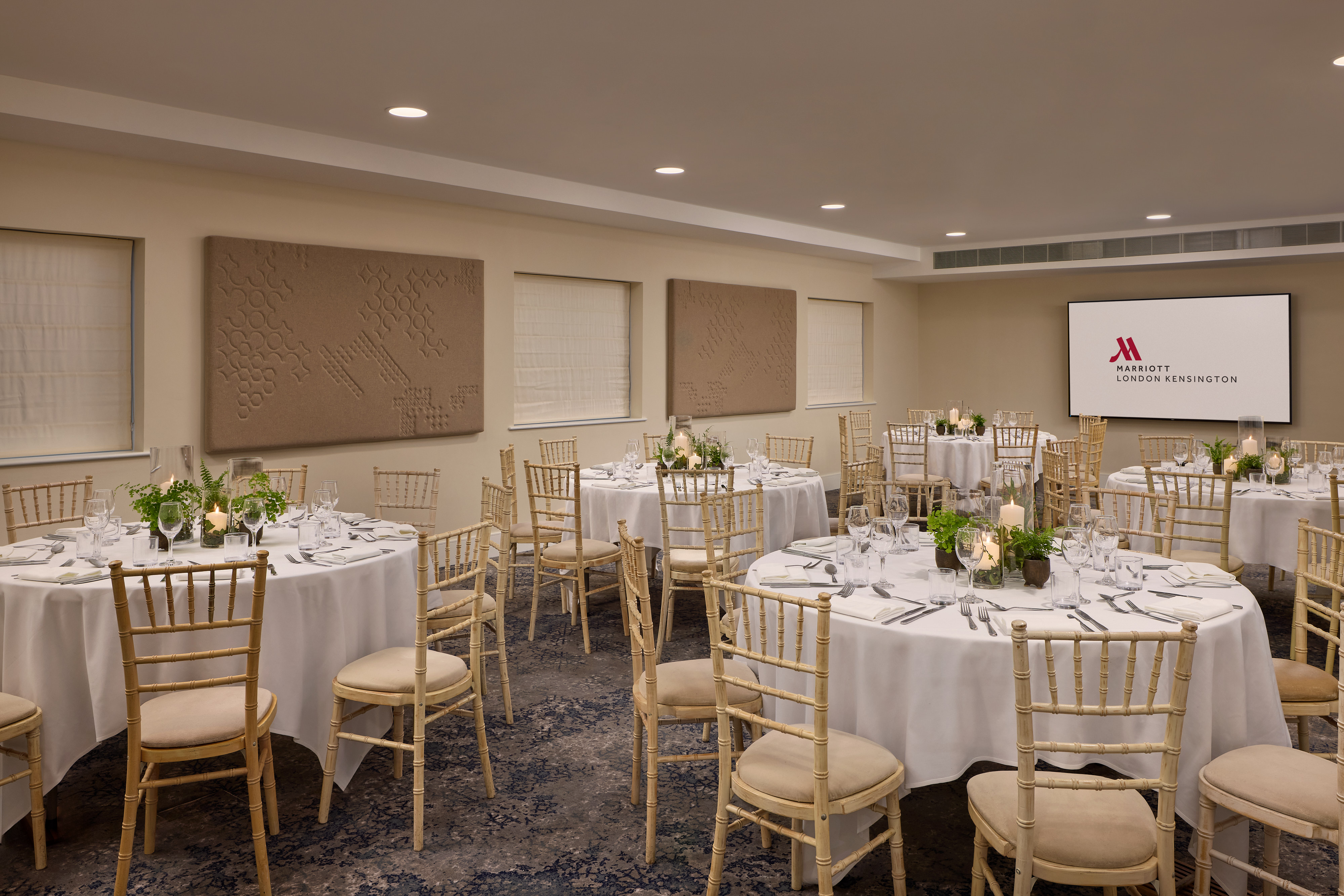 Gallery 4 banquet room with gold Chiavari chairs for corporate dinners and workshops.