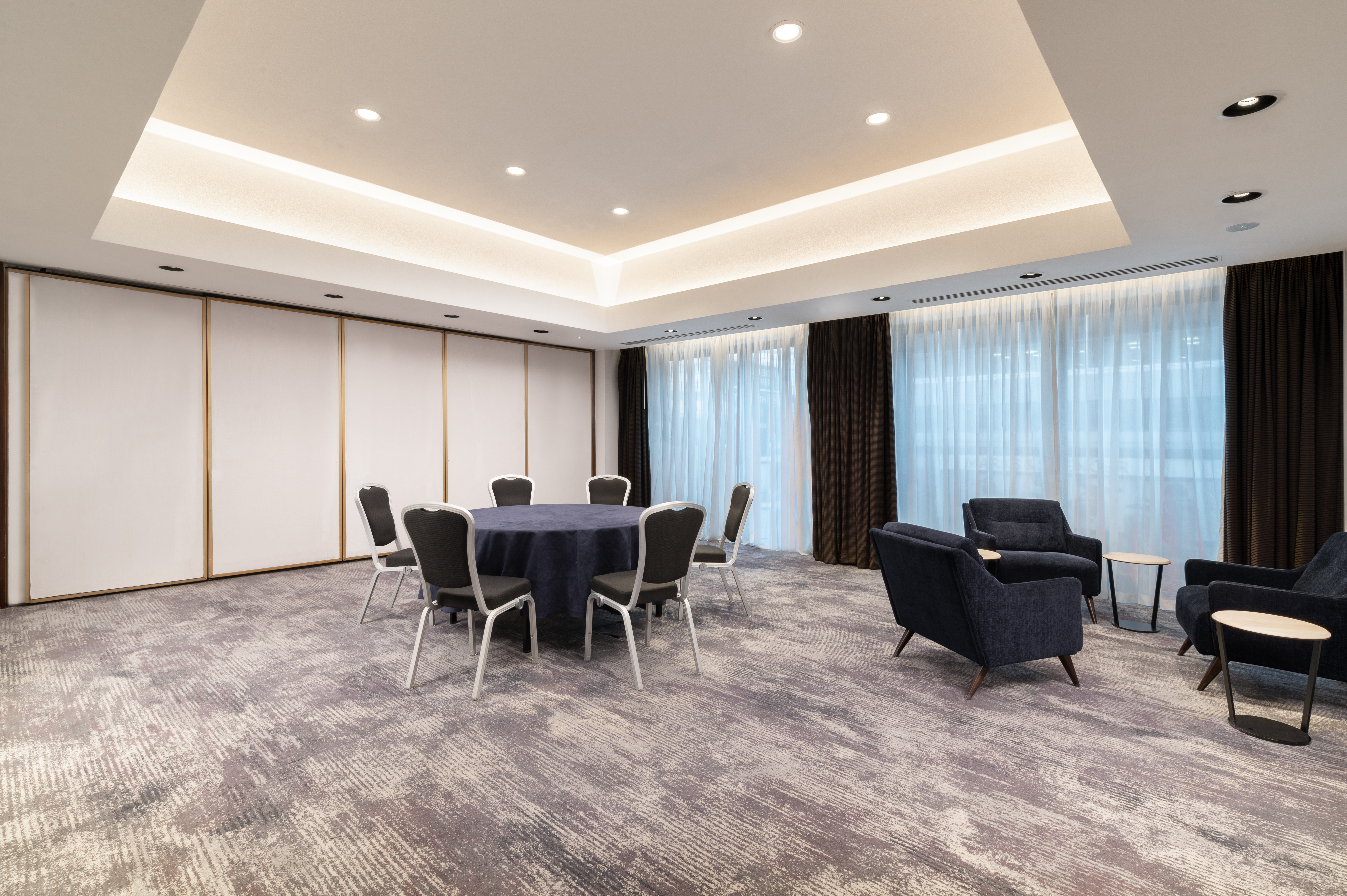 Hilton London Metropole breakout room with hybrid layout for strategy sessions and team workshops.