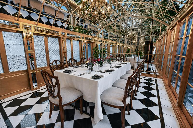 Mirror Room private dining space with glass architecture for VIP dinners and board meetings.