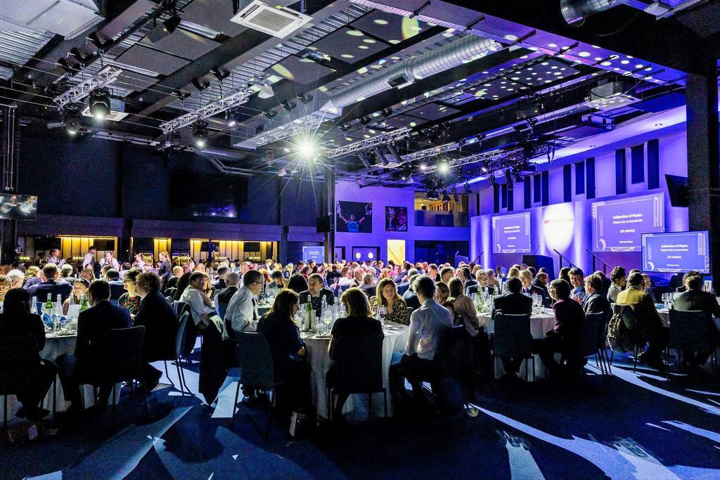 Kia Oval suite 175 gala dinner with atmospheric lighting and stage for premium corporate events.