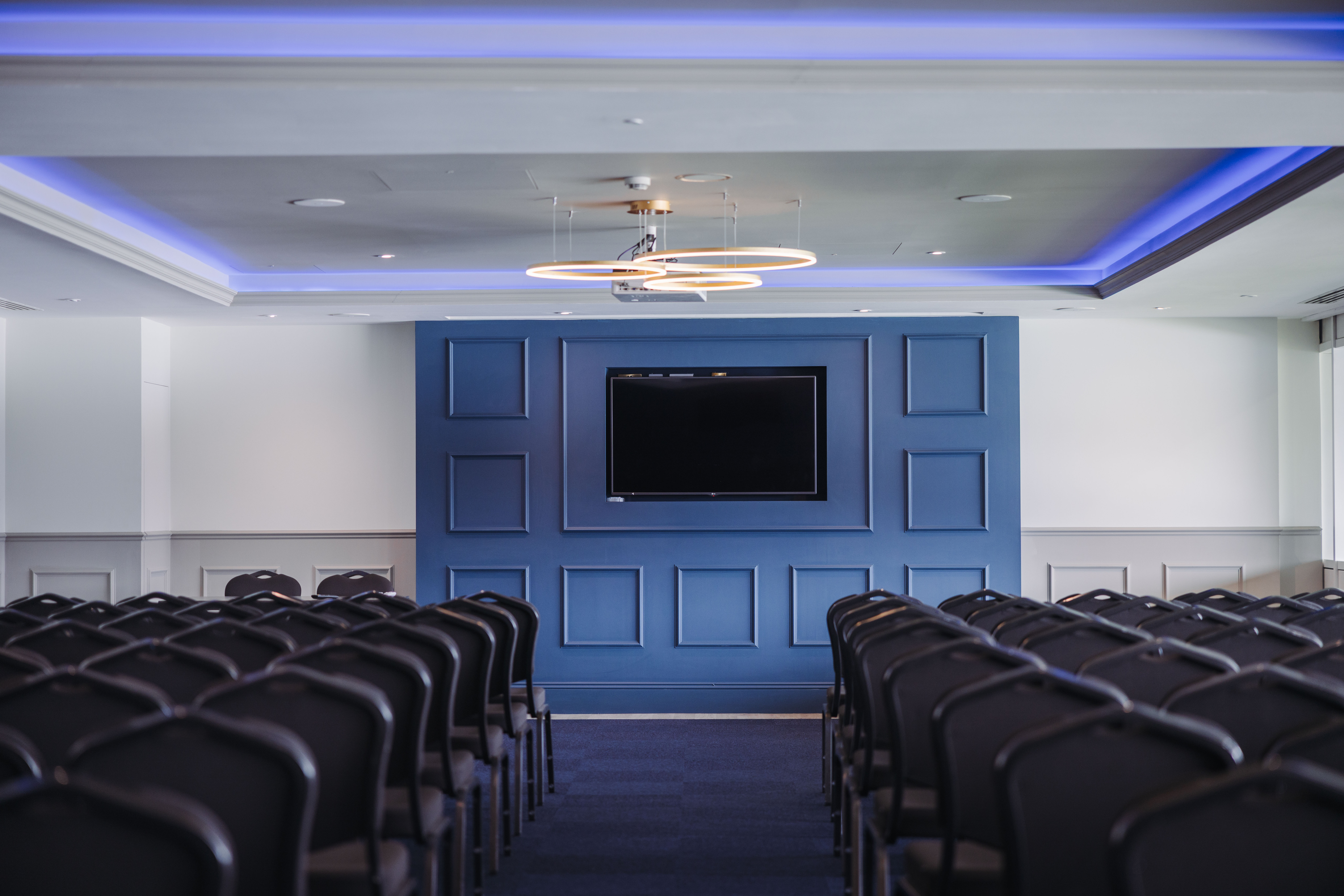 India Room at Kia Oval: theater-style event space with blue LED accents for corporate presentations.
