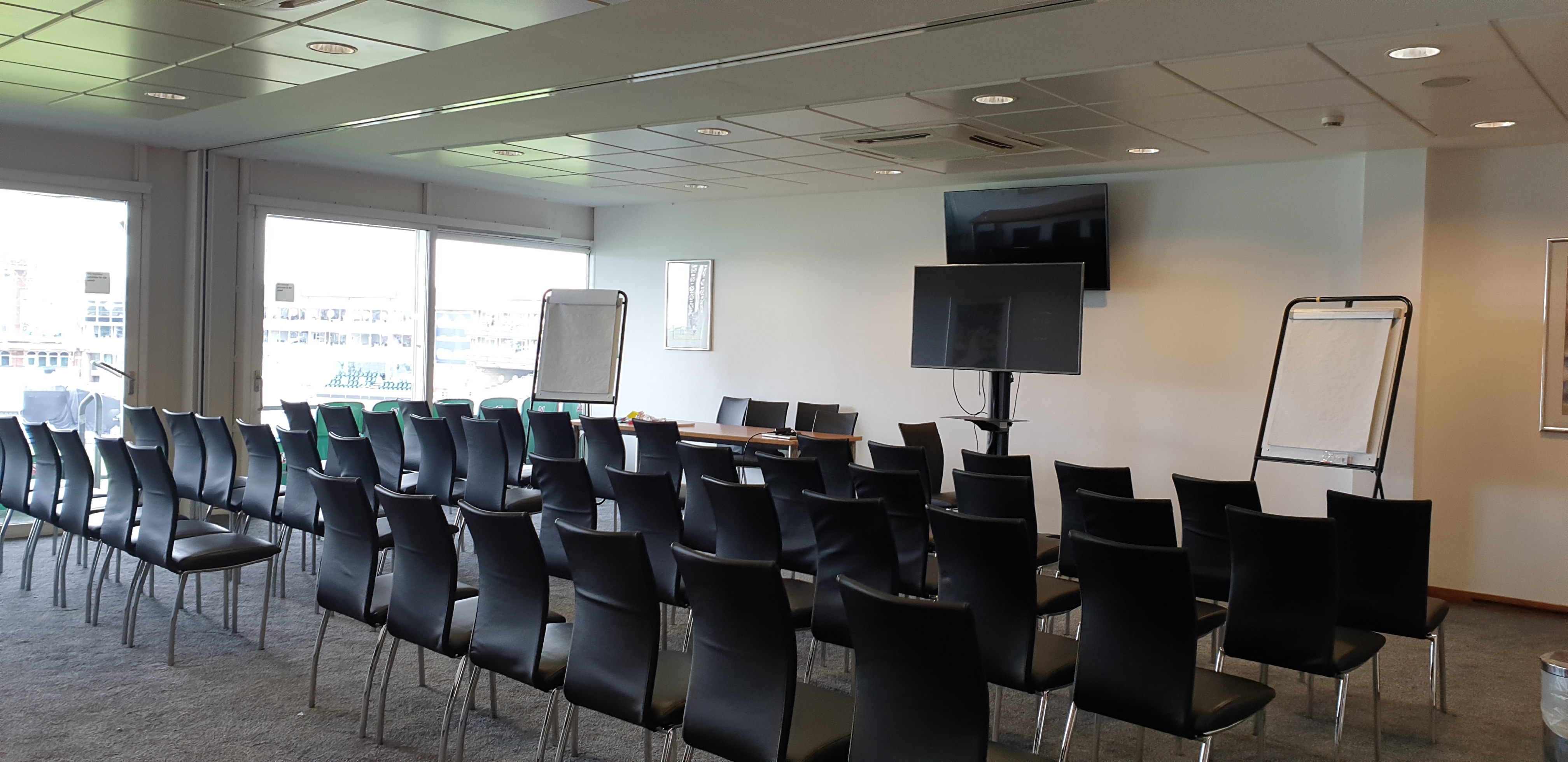 Double Executive Box at Kia Oval: theater-style corporate meeting room for business presentations.