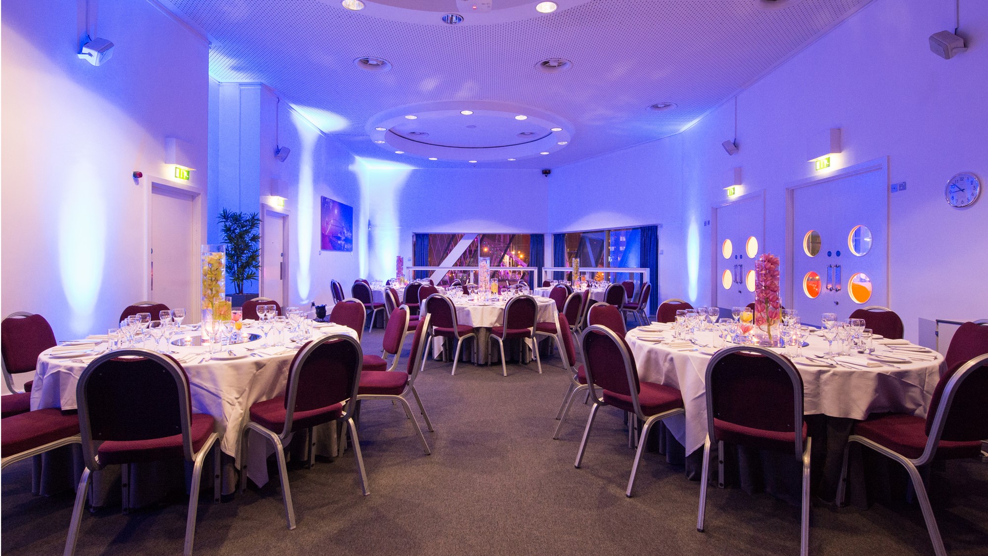 Hexagon Room at Lowry gala dinner event space with atmospheric architectural uplighting.