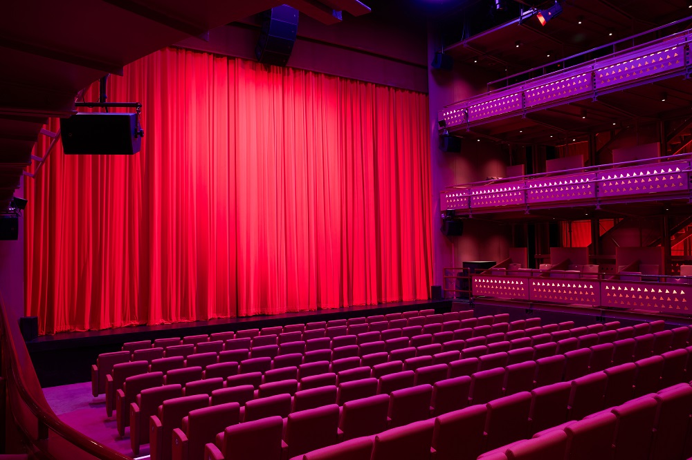 Quays Theatre at The Lowry: tiered auditorium interior for corporate keynotes and conferences.