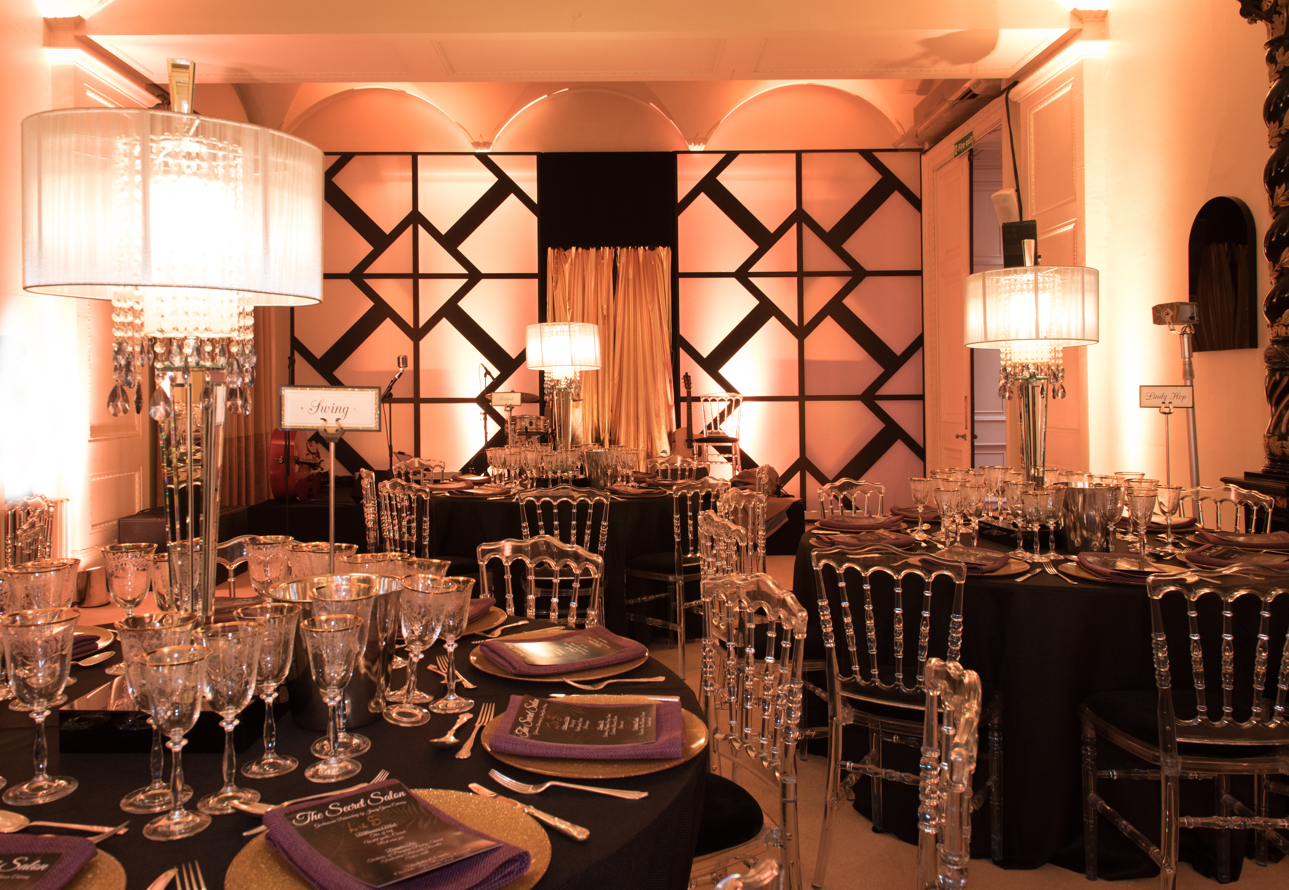 Elegant event space in Kent House with chic black and gold decor for upscale gatherings. - Banner