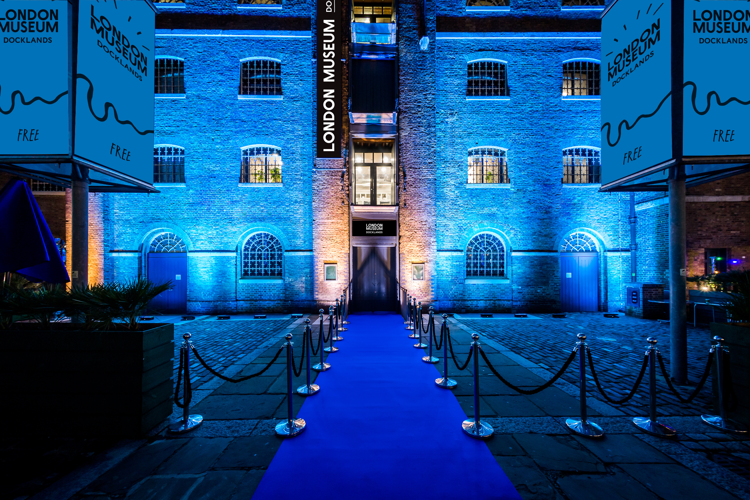 London Museum Docklands gala, blue uplighting, brick venue, product launch.