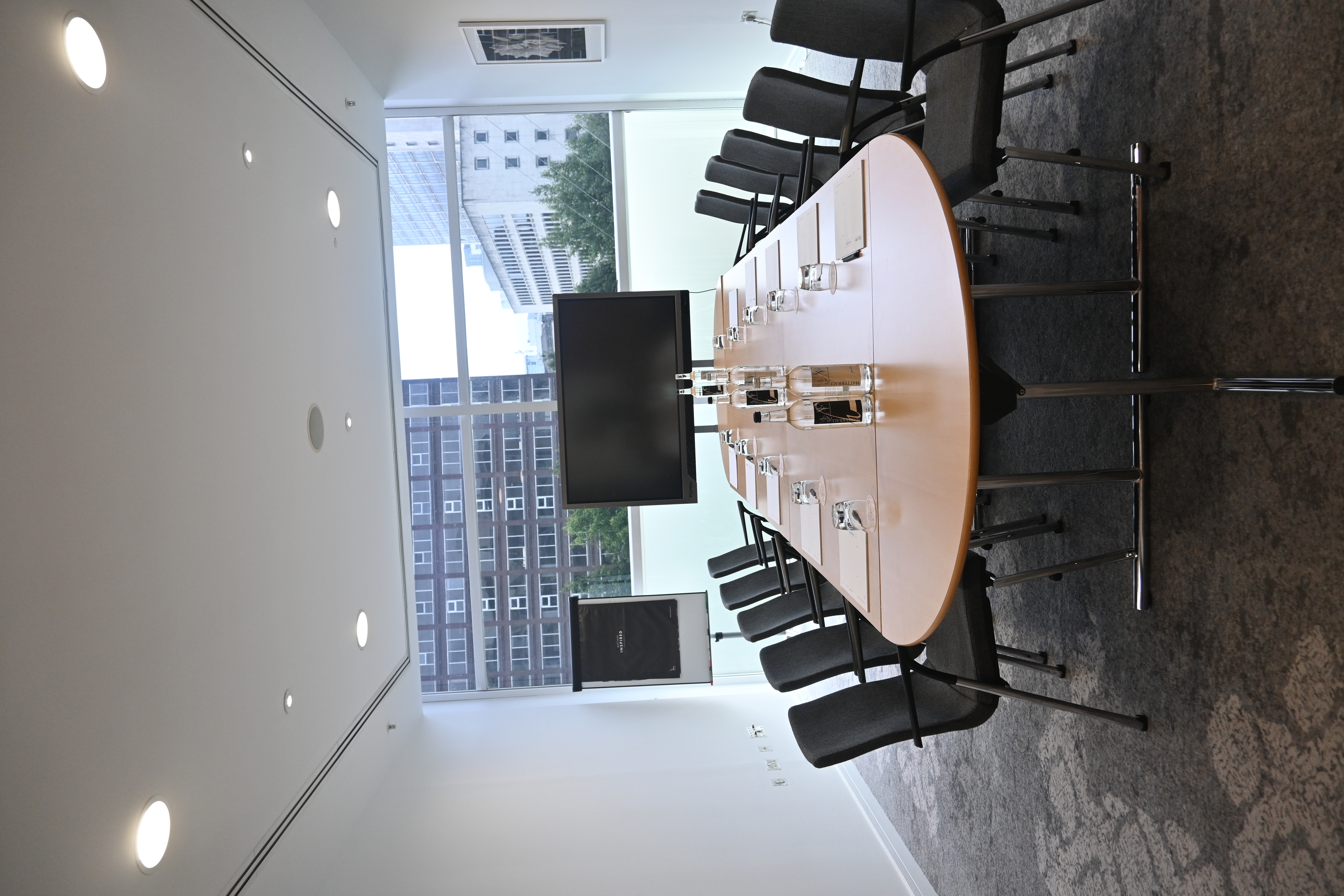 Boardroom setup in The Lowry Hotel Meeting Room 1, featuring large oval table for business events.