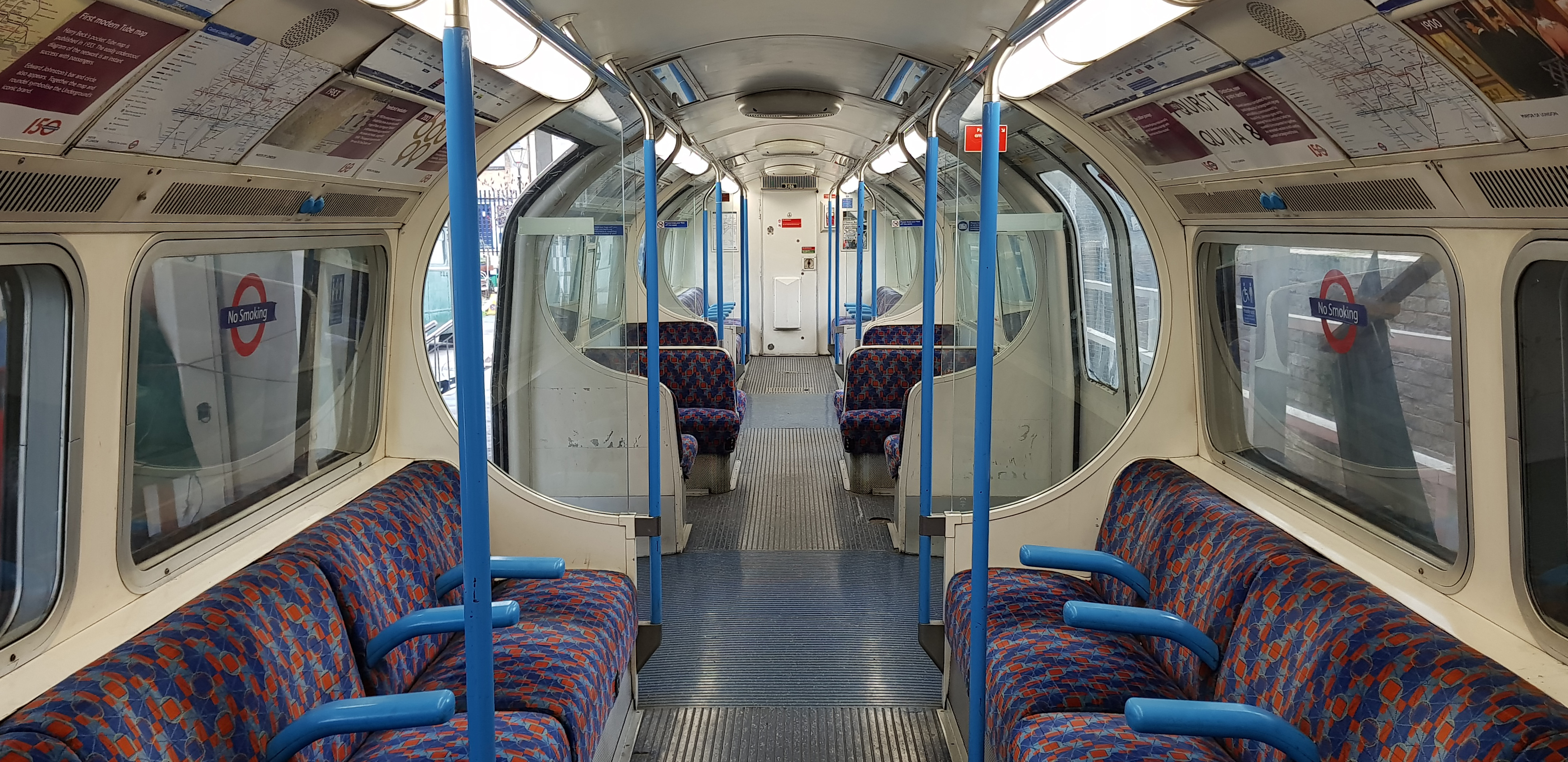 "Spacious Victoria Line Tube carriage interior for accessible group travel at events."