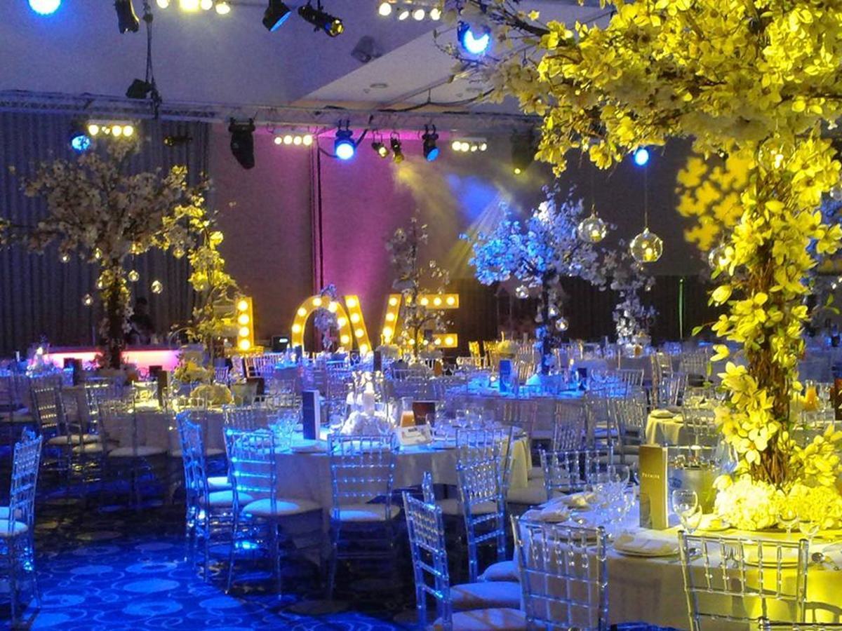 Edgbaston Stadium banqueting suite with dramatic lighting for corporate events and gala dinners. - Banner