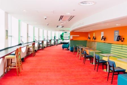 Modern Mezzanine at Unique Venues Birmingham, vibrant design for informal meetings and networking.